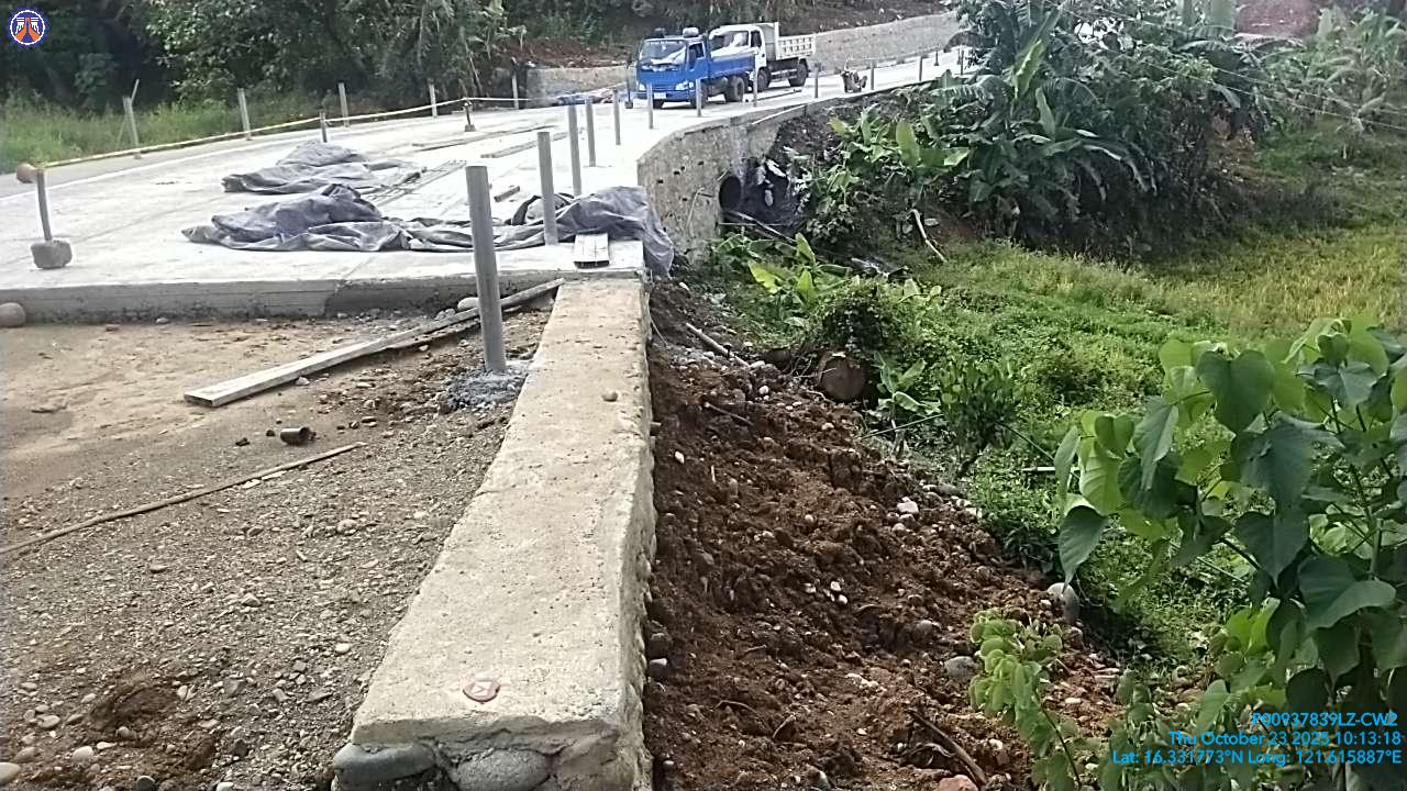 Ongoing road construction with concrete works and heavy equipment